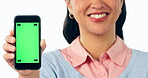 Happy woman, phone and hands with green screen in advertising or marketing against a studio background. Closeup of female person showing mobile smartphone app, mockup or display with tracking markers