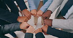 Business people, fist bump and teamwork, group solidarity or synergy and power for goals, success and motivation above. Diversity, employees closeup and hands together, mission or integration circle