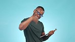Man, clipboard and hand a smile, portrait and studio by blue background. Black person, sign up and volunteer for cause, vote and glasses in casual, fitness and register in mockup, point and positive