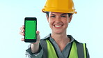 Studio, happy woman or engineer with phone green screen for engineering news or construction advertising. Contractor, project notification or hand with architecture mockup space on blue background