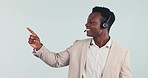 Call center, pointing and black man in studio for customer service, help and online consulting. Telemarketing, business choice and person for CRM support, decision or communication on gray background