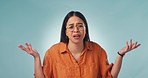 Confused, face and a woman with a shrug on a studio background for question, doubt or angry. Frustrated, stress and portrait of a young girl or designer with a gesture for a problem, mistake or fail