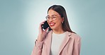 Phone call, smile and business woman in studio for gossip, news or secret on blue background. Smartphone, conversation and female entrepreneur excited for wow, drama or app, sign up or deal promotion