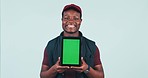 Happy black man, tablet and green screen for advertising or marketing against a studio background. Portrait of African male person or delivery guy smile and showing technology app, display or mockup