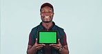 Happy black man, tablet and green screen for marketing or advertising against a studio background. Portrait of African male person or delivery guy smile and showing technology app, display or mockup