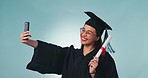 Happy woman, graduation and certificate for selfie, photography or memory against a studio background. Female person, student or graduate smile for photograph or picture with qualification or diploma