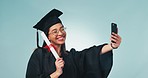 Happy woman, graduation and certificate in selfie, social media or memory against a studio background. Female person, student or graduate smile in photography or picture with qualification or diploma