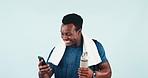 Happy black man, fitness and phone in winning, success or good news against a studio background. Excited African male person or athlete smile in celebration for sports, victory or health and wellness