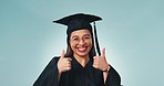 Happy woman, student and thumbs up for graduation, success or thank you against a studio background. Portrait of female person or graduate smile with like emoji, yes sign or OK for job well done