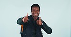 Student, thumbs up and happy in studio on blue background for mockup with smile, face and social media. African, person or man in excitement for offer, deal or promotion for funding for university