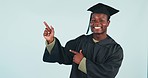 Happy black man, graduation and pointing in advertising or marketing against a studio background. Portrait of African male person, student or graduate smile and showing deal or information on mockup