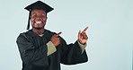 Happy black man, graduation and pointing in marketing or advertising against a studio background. Portrait of African male person, student or graduate smile and showing deal or information on mockup