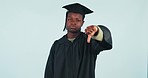 Student, unhappy and disagree with thumbs down in studio on blue background for mockup of graduation. Black, person or man in disappointment for choice, decision or feedback of presentation with face