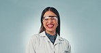 Science woman, face and laugh in studio for funny joke, ppe glasses and happy by blue background. Doctor, research expert and comic smile with lab coat for medical innovation, comedy and clinic job