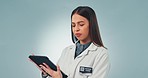 Tablet, doctor and confused with a science woman in studio on a gray background for research or innovation. Technology, planning and problem solving with a young scientist looking for a breakthrough