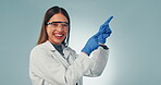 Woman, hands and happy scientist pointing in studio background with promotion or presentation of information. Science, portrait and person show mockup with advice, review or menu option in laboratory