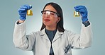 Doctor, sample and reaction with a science woman in studio on a gray background for research or innovation. Medicine, chemical biology and experiment with a young scientist working on a breakthrough