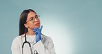 Woman, doctor is thinking and healthcare ideas with questions and medical future isolated on blue background. Health, wellness and problem solving in medicine, mockup space and insight in a studio