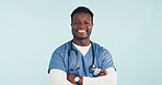 Studio smile, arms crossed and black man, nurse or surgeon for healthcare, job experience or hospital support. Medical pride, portrait and medicine expert, doctor or African person on blue background