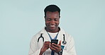 Black man, doctor with smartphone and scroll online with social media, communication and telehealth in studio. Contact, reading medical notification and healthcare professional on blue background
