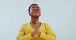 Wish, praying and black woman in studio with anxiety and stress with hope and emoji hand sign. Blue background, support and prayer gesture for question, religion and please for empathy or win