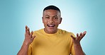 Wow, happy and face of man on a blue background for hearing good news or conversation. Announcement, smile and portrait of a person with a reaction or expression on a backdrop with shock or surprise