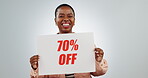 Discount, sign and retail promotion, black woman and face, excited with info on white background. Poster, billboard or banner with sale news, announcement and dance, board for advertising in studio