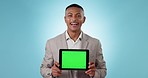 Happy businessman, tablet and green screen in advertising or marketing against a studio background. Portrait of man or business employee showing technology app, display or tracking markers on mockup