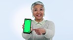 Green screen, phone and senior woman hands show presentation, mockup and pointing to app, tracking markers or menu. Easy, steps and person with promotion of tech, information and gesture to cellphone