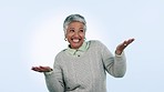 Wow, celebration and face of senior woman dance in studio for news, success or deal on blue background. Happy, face and portrait of elderly female winner with palm scale balance, energy or giveaway