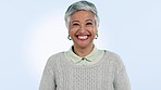 Happy, face and senior woman in studio laugh at funny, comedy or reaction on blue background. Smile, comic and portrait or elderly female model with good mood, confidence and retirement freedom