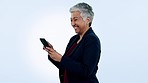 Happy, laugh and senior business woman with phone in studio for funny, text or chat on blue background. Smartphone, app and elderly female ceo with online comic, social media or gif communication