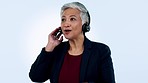 Call center, studio or senior woman in communication, speaking or talking to help in customer services. Blue background, virtual assistant or mature sales agent with microphone in CRM or tech support