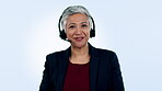 Call center, face or senior woman in communication, speaking or talking to help in customer service. Blue background, virtual assistant or mature sales agent with microphone in tech support in studio