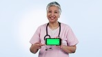 Doctor, nurse and phone green screen or presentation, talking of healthcare information or telehealth in studio. Face of medical woman on mobile app mockup, video tracking marker and blue background