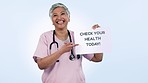 Senior woman, doctor and sign with comment for healthcare feedback against a studio background. Portrait of mature female person or medical nurse pointing to billboard, poster or patient health FAQ