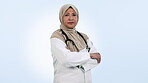 Medical doctor, serious muslim woman and arms crossed in studio for healthcare, medicine or wellness. Hijab, islam and professional person with a stethoscope, portrait and white background with pride