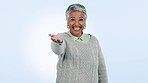 Mature woman mockup, portrait and happy with smile, talking and blue studio background using hand, point and cheerful. Face, positive motivation and joyful with excitement, energy and loud laughing
