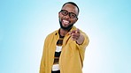 Pointing, you and face of black man on blue background for promotion, encouragement and choosing. Emoji, happy and portrait of person with hand gesture for thank you, agreement and decision in studio
