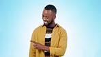 Black man, pointing and yes of decision for promotion, checklist and presentation for deal and choice. Blue background, studio and happy model with information and steps of advertising with a smile