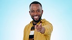 Pointing, you and happy black man on blue background for promotion, encouragement and choosing. Emoji, invite and portrait of person with hand gesture for thank you, agreement and decision in studio