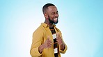 Thumbs up, face and man wink in studio for success, winning deal and achievement on blue background. Portrait, happy african model and blink eyes with like, emoji, sign and voting in support of trust