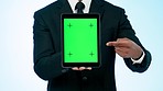 Businessman, hands and pointing to tablet green screen in advertising or marketing against a studio background. Closeup of business person show technology app, display or tracking markers on mockup