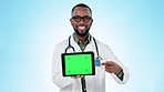 Black man, doctor and tablet green screen in healthcare advertising or marketing against a studio background. Portrait of African male person or medical show technology app, display or mockup space