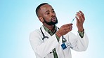 Doctor, vaccine injection and man with bottle, immunity and healthcare safety on blue background. African medical worker with needle, vial and medicine to help virus, vaccination or insulin in studio