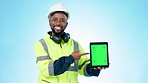 Black man, architect and tablet with green screen for construction advertising against a studio background. Portrait of happy African engineer or contractor showing technology app, display or mockup 