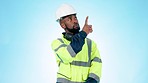 Pointing, construction and black man in studio with decision, options and choice mockup. Engineering, architect and portrait of worker with disagreement, no or yes and confused on blue background