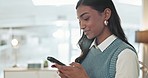 Happy indian woman, phone and typing in office for social network, mobile chat and digital contact. Young business worker scroll on smartphone, reading news app and search media of information online