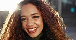 Closeup, face and woman in the city in the morning for travel, business or work. Happy, working and portrait of young employee or worker in a town for commute, professional career or positi attitude