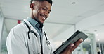 Tablet, research and happy black man doctor on internet for medical or healthcare information online in a hospital. Smile, medicine and professional typing on health website or app in a modern clinic